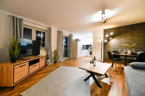 Exklusives-City-Apartment mit gratis Tiefgarage, Balkon, Waschtrockner, Netflix